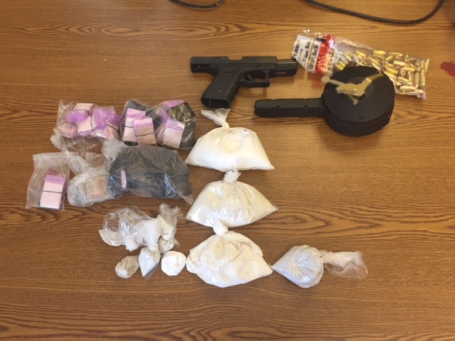 Two Charged after Loaded Gun, Suspected Heroin Found During Court-Ordered Eviction